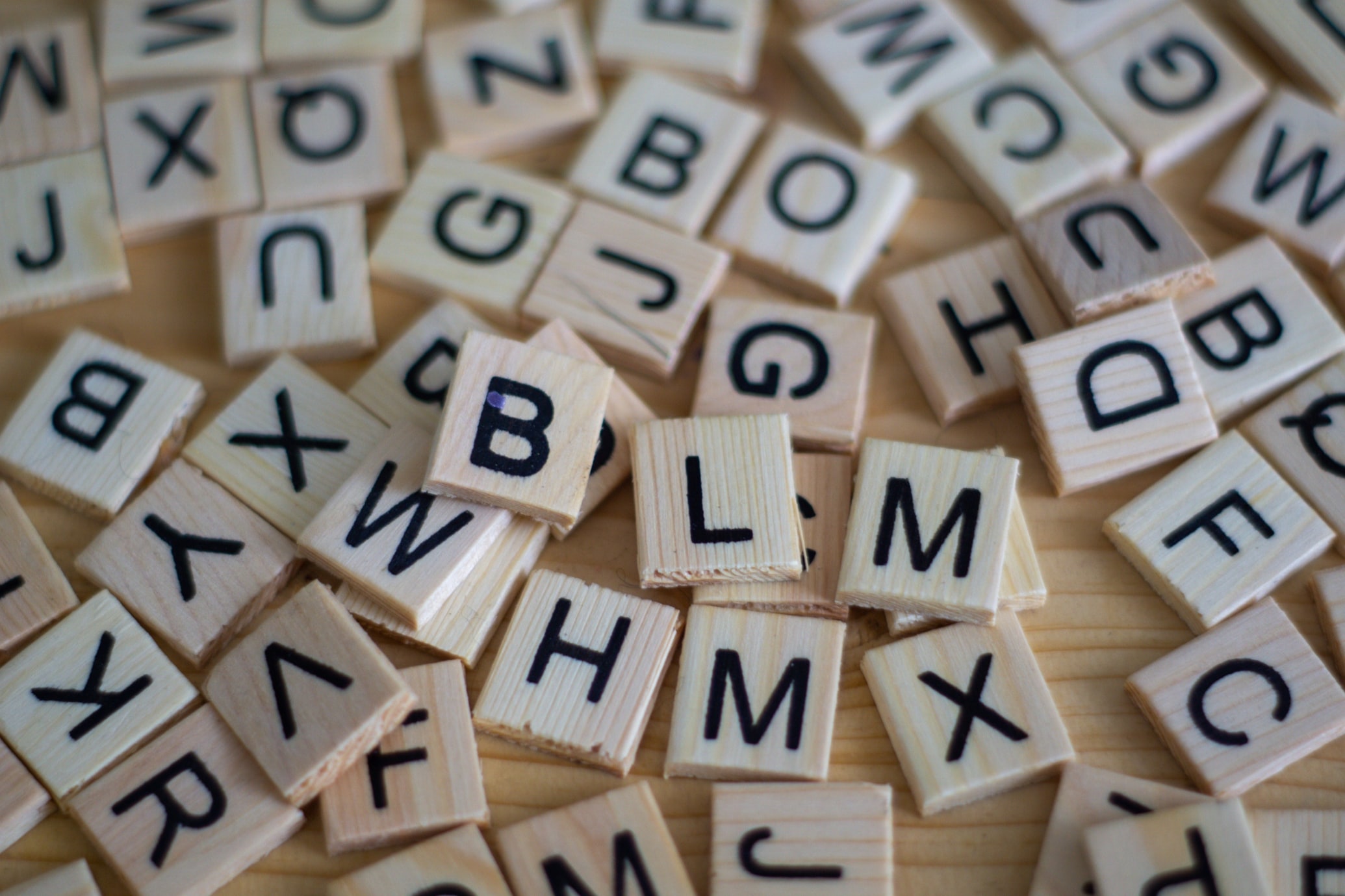 Scrabble tiles in a pile. 